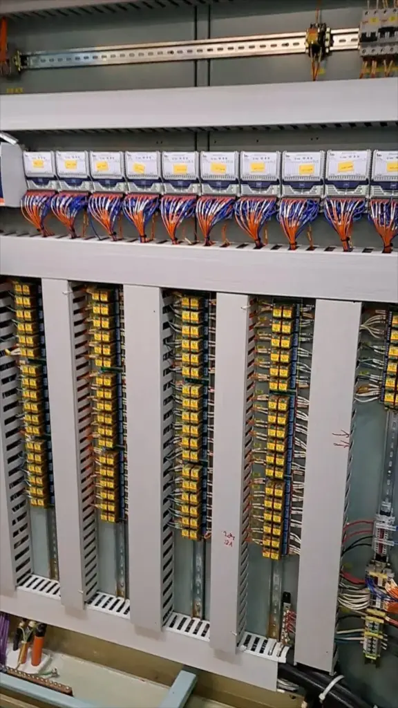 Relay and terminal rows inside a ship control panel